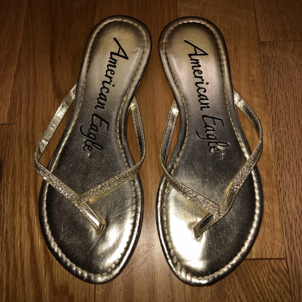 American Eagle gold glitter flip flops
